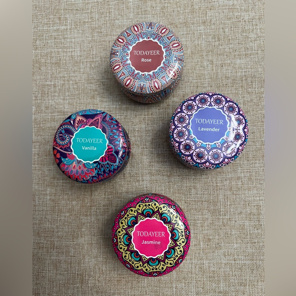 (4) soy candles in decorative tins. 4 different scents.